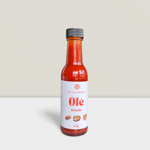 Bottle of Olé sriracha-style hot sauce made from red jalapeño purée by The Flavorsmith NZ